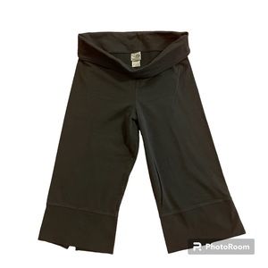 Champion C9 capri style black legging with split at back of leg. Fold over waist